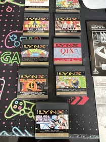 Atari Lynx Handheld Console Bundle with Carrying Case and 11 Games Manuals