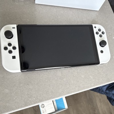 Nintendo Switch OLED Bundle with Pikachu Case, Dock, White Joy-Cons, 6 Games