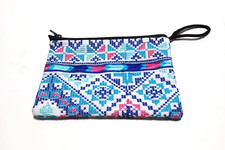 A Palestinian hand-embroidered women's wallet, a heritage handbag, a souvenir gi