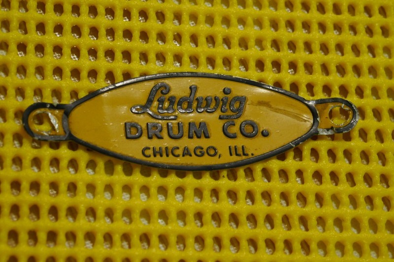 VINTAGE LUDWIG DRUM CO. BADGE - BLACK/YELLOW - GOOD CONDITION - CHICAGO, ILL USA