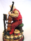 Musical figurine of Santa playing the cello “We Wish You a Merry Christmas” — photo 4