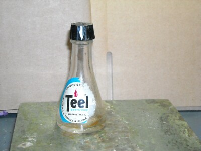 Vintage clear Teel bottle paper label ripped proctor &gamble 31.7% alcohol 2 7/8