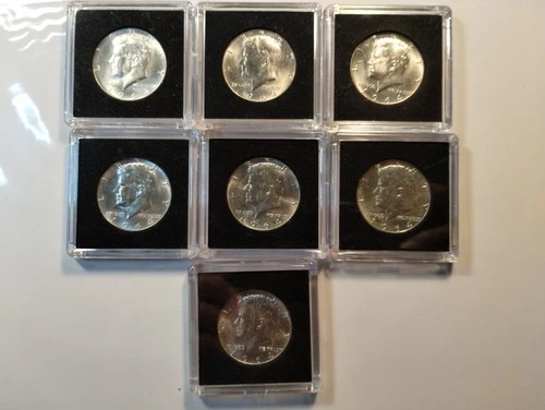 7 Each 1964 Kennedy Half Dollar BU To AU 90 % Silver Coins. Encapsulated