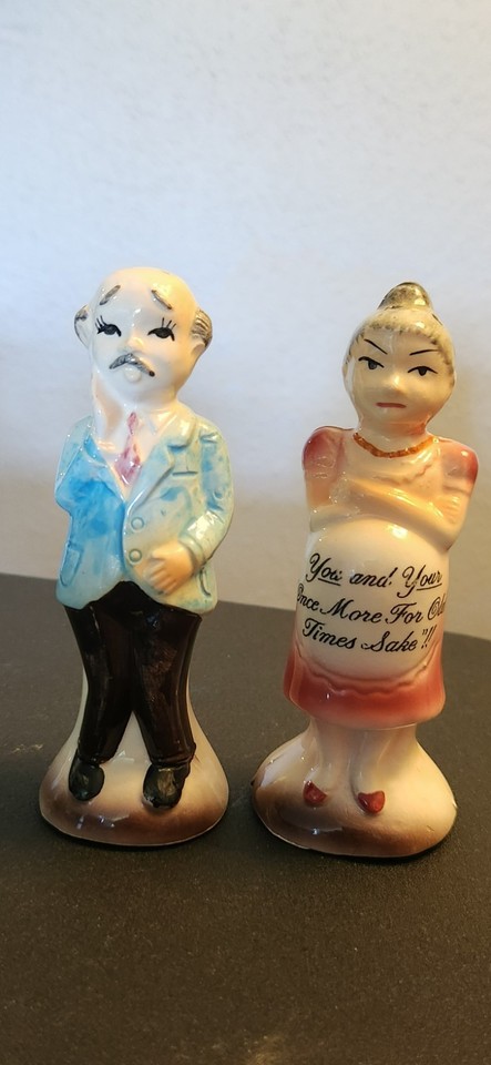 Vintage Enesco salt & pepper shakers depicting a pregnant elderly couple — genuinely bizarre, made-in-Japan humor that belongs on a shelf of conversation starters.