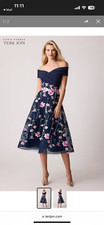 Navy cocktail dress with flowers, worn once, size 6. Teri Jon