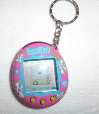 Tamagotchi Connection V2 2004 Pink w/ Blue Trim Hawaiian Flower Shell Beach