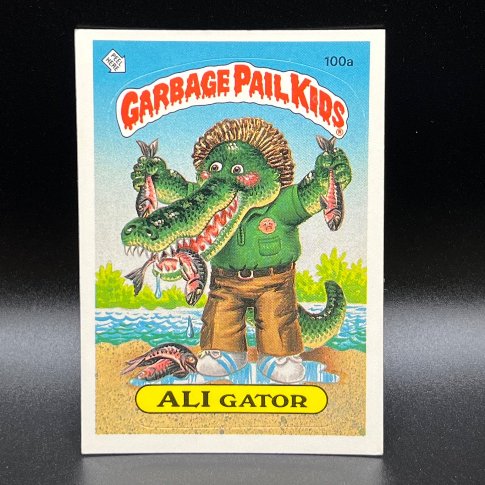 ALI Gator #100a 1986 Garbage Pail Kids trading card — raw and PSA graded price guide