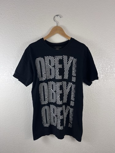 Obey graphic t-shirt featuring bold “OBEY OBEY OBEY”