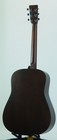 Dark wood Martin D-16GT back with silver hardware, six strings, and subtle grain pattern on glossy finish.