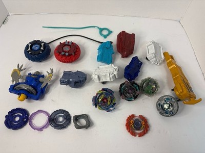 Various Beyblades And Launchers