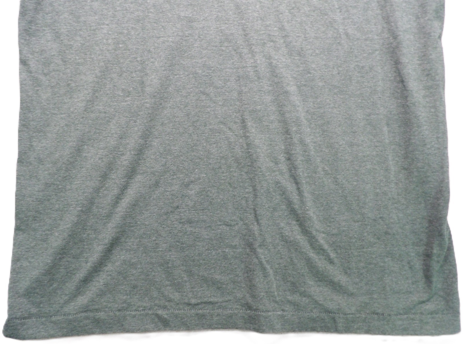Gray VTG men’s short-sleeve shirt with single stitch, small pocket, and visible collar stitching on back.