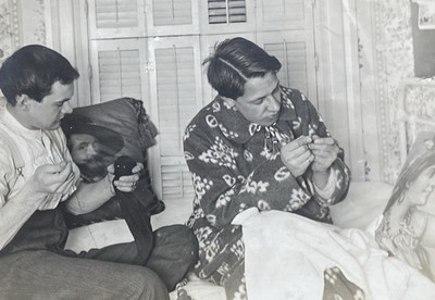 Two Young Men Sewing & Darning Socks on a Bed w/ Beautiful Pillows Vintage Photo