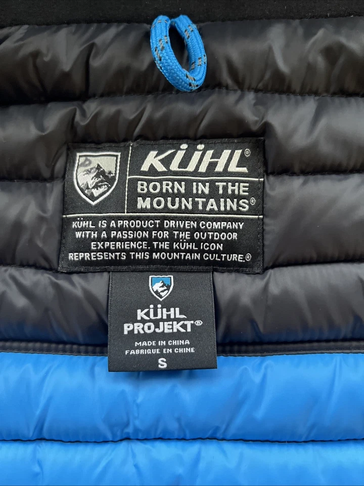 Chaqueta acolchada con capucha Kuhl para mujer talla pequeña negra con aislamiento Spyfire plumón de ganso Foto 4 de 4