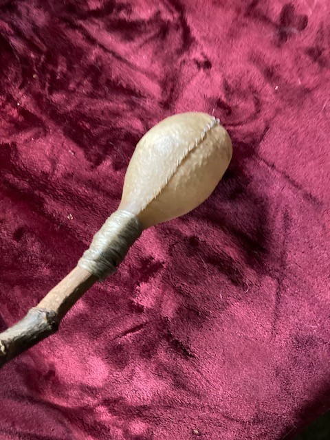 antique native rattle made from bull testicle