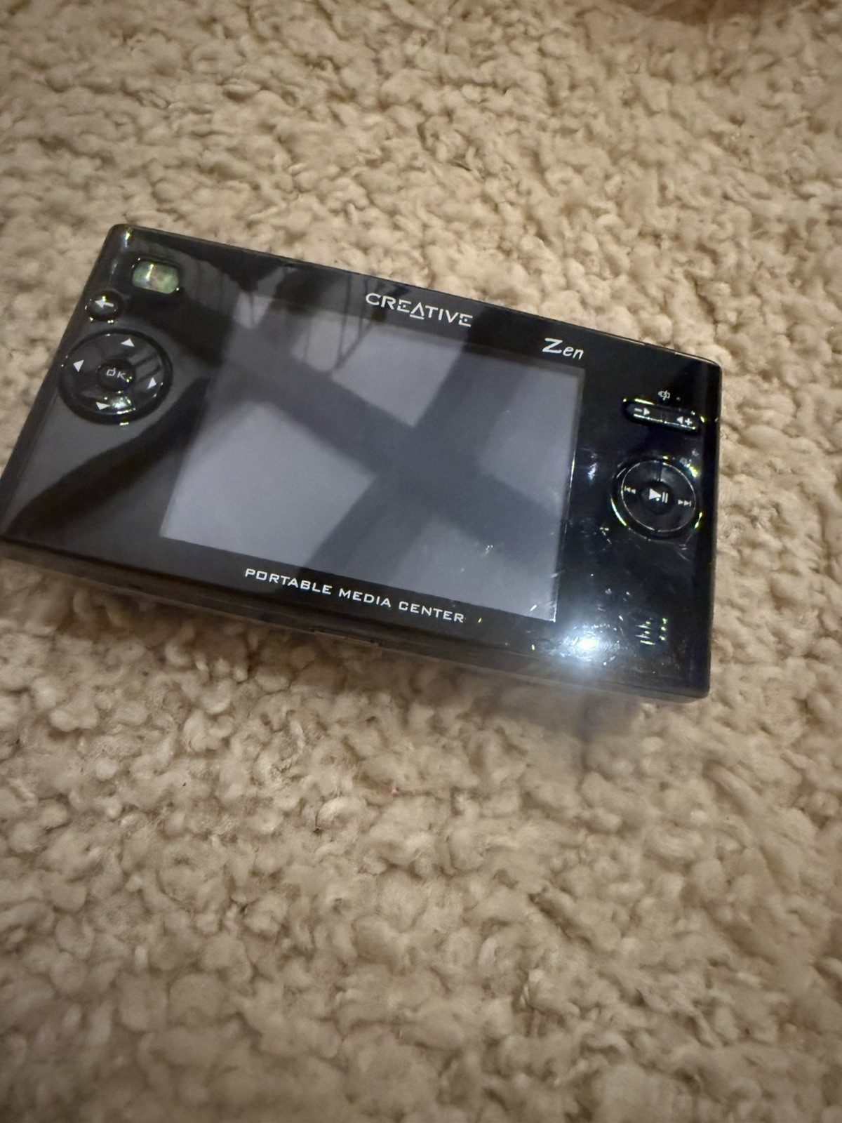 creative zen portable media center. Untested.