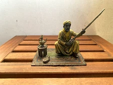 Bronze sculpture  style Vienna Arab with rifle on a carpet after Franz Bergman