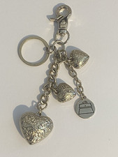 Kathy Van Zeeland Gold tone handbag heart charms