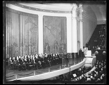 Group seated on stage; includes Robert P. Lamont, Herbert Hoover, Lou Hoover,