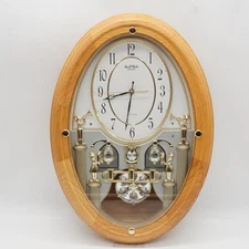 Small World Solid Oak Musical Motion Clock W/  12 Melodies - 3 Christmas Songs