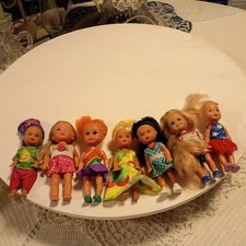 lot of 7 Kelly Dolls each or dressed in clothing