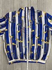 White silk COACO women’s XL full zip with blue and white striped panels featuring gold golf club graphics.