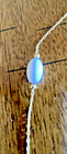 VINTAGE 22" WHITE BEADS ON DAINTY GOLD TONE NECKLACE WITH A "T" OR "CROSS" HANG — photo 2