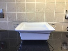 white ceramic serving dish on stand