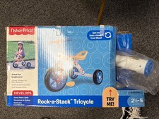 Triciclo Fisher-Price Rock-A-Stack para niños de 2,5 a 5 años con asiento ajustable y EV