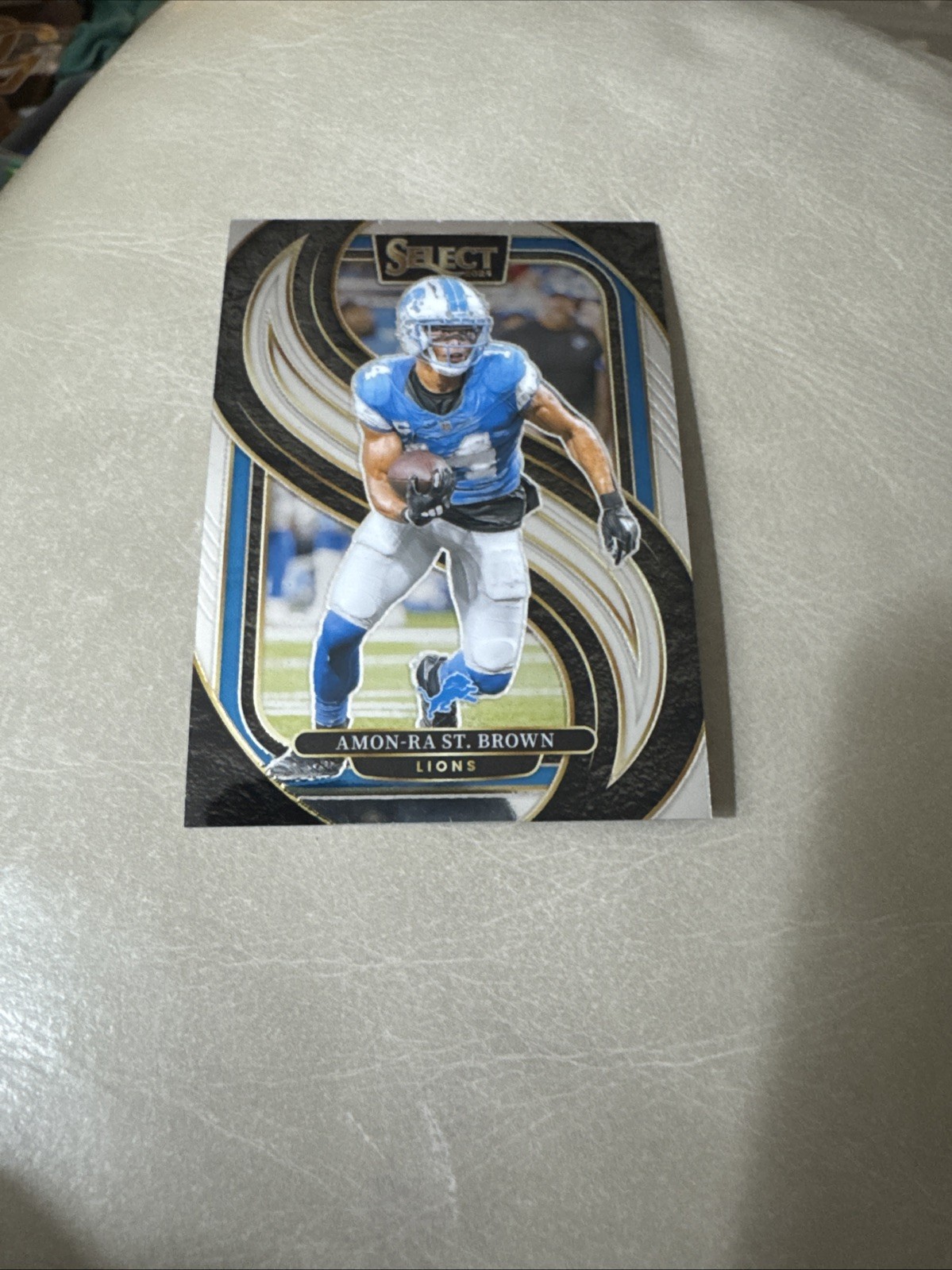 Amon-Ra St. Brown #105 Football Cards 2024 Panini Select trading card — raw and PSA graded price guide