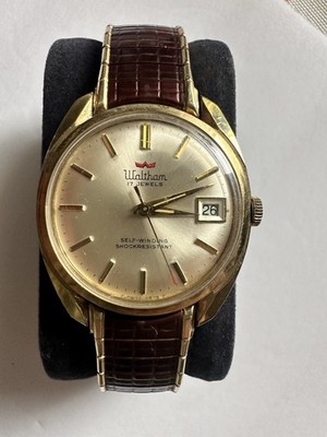 vintage 1960s Waltham 17-jewel self-winding watch in a gold-plated case.