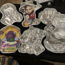 HUGE Lot of 7 Wilton Cake Pans  – Mickey, Tweety, Barney, Blues Clue, Elmo, Cab.