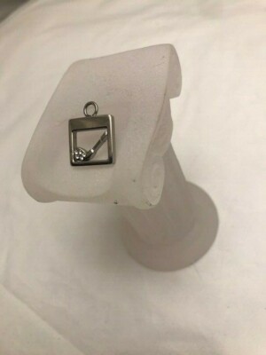 Beautiful silver square with a brat in the middle pendant 