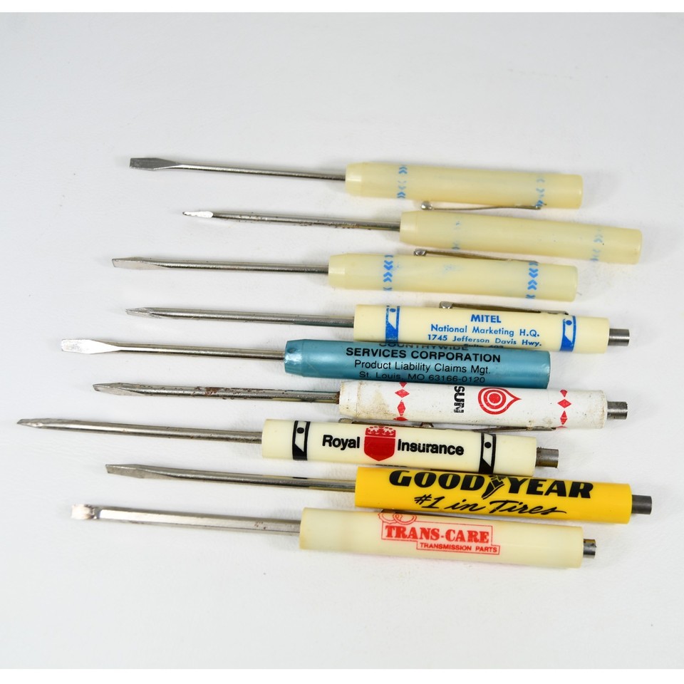A lot of 9 vintage advertising pocket screwdrivers from Goodyear, Trans-Care, Royal Insurance and more — a wildly specific slice of mid-century corporate promo culture that's weirdly irresistible.