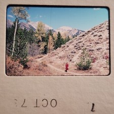 1970s Yellowstone National Park Snapshot Photo, Woman in Red, Mountains