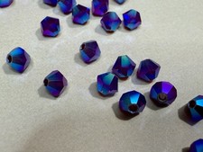 Swarovski - Siam AB2X - 5328 - 4mm Bicone Beads