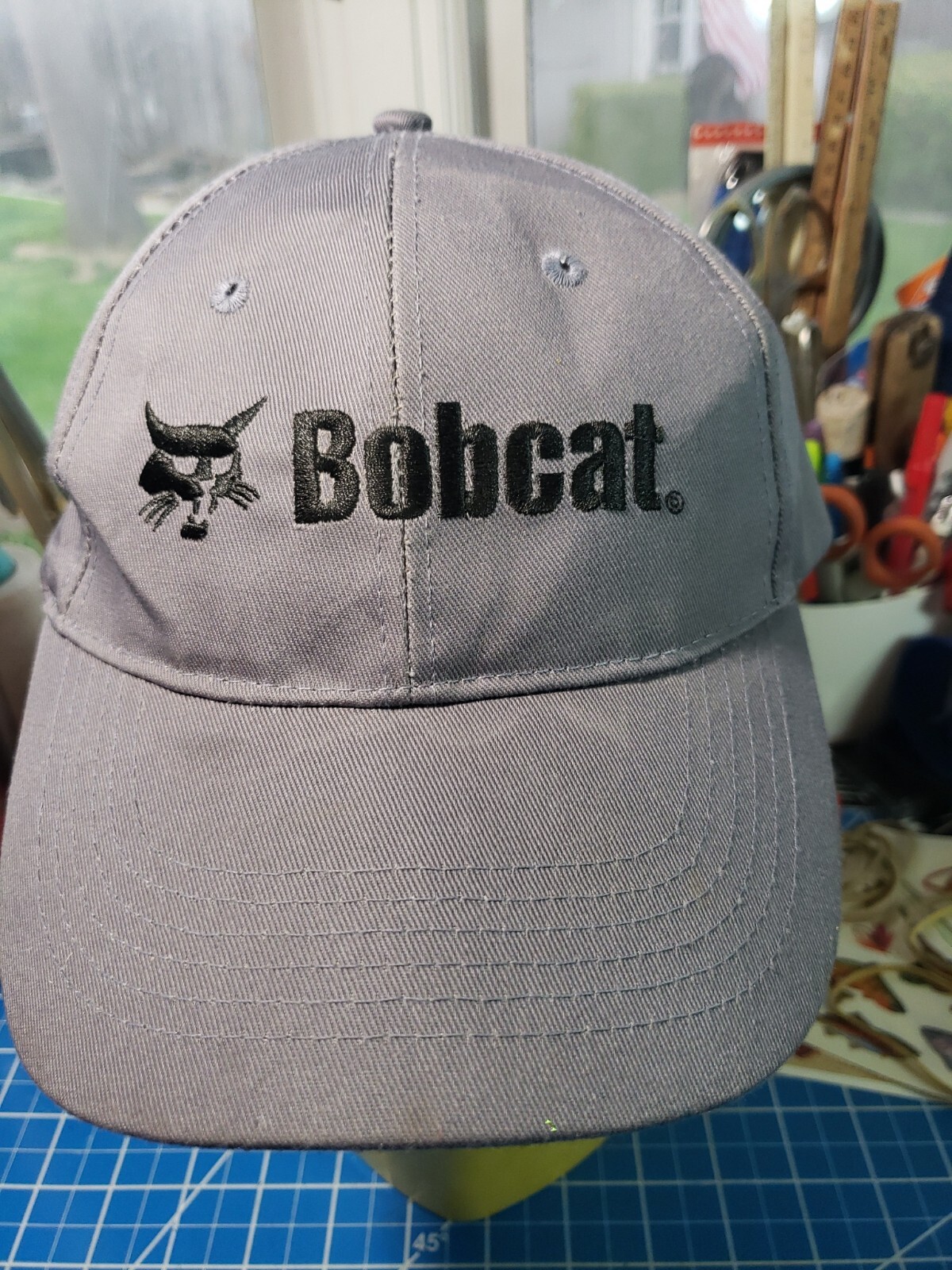 Bobcat Ball CapHook and Loop adjustableGrey w/Black embroidery of