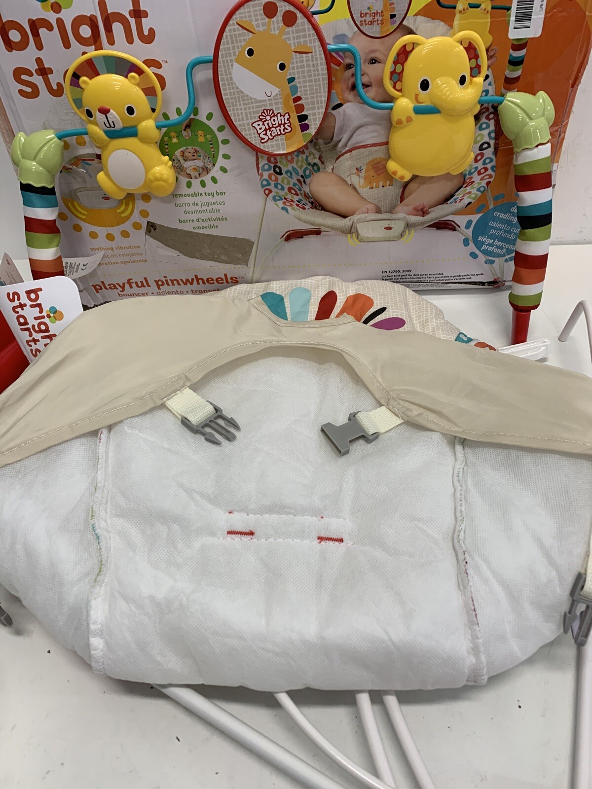 bright starts playful pinwheels bouncer