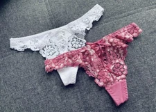 2 Pack, White And Fuchsia Pink Lacey Thongs. Brand New With Tags. Sexy Detail.