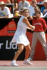 Monica Seles of Yugoslavia hits a return at a women's singles matc- Old Photo 30