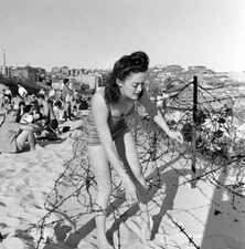WW2 WWII Photo Italian Girl on Beach Climbs Over Barbed Wire World War Two/ 1710