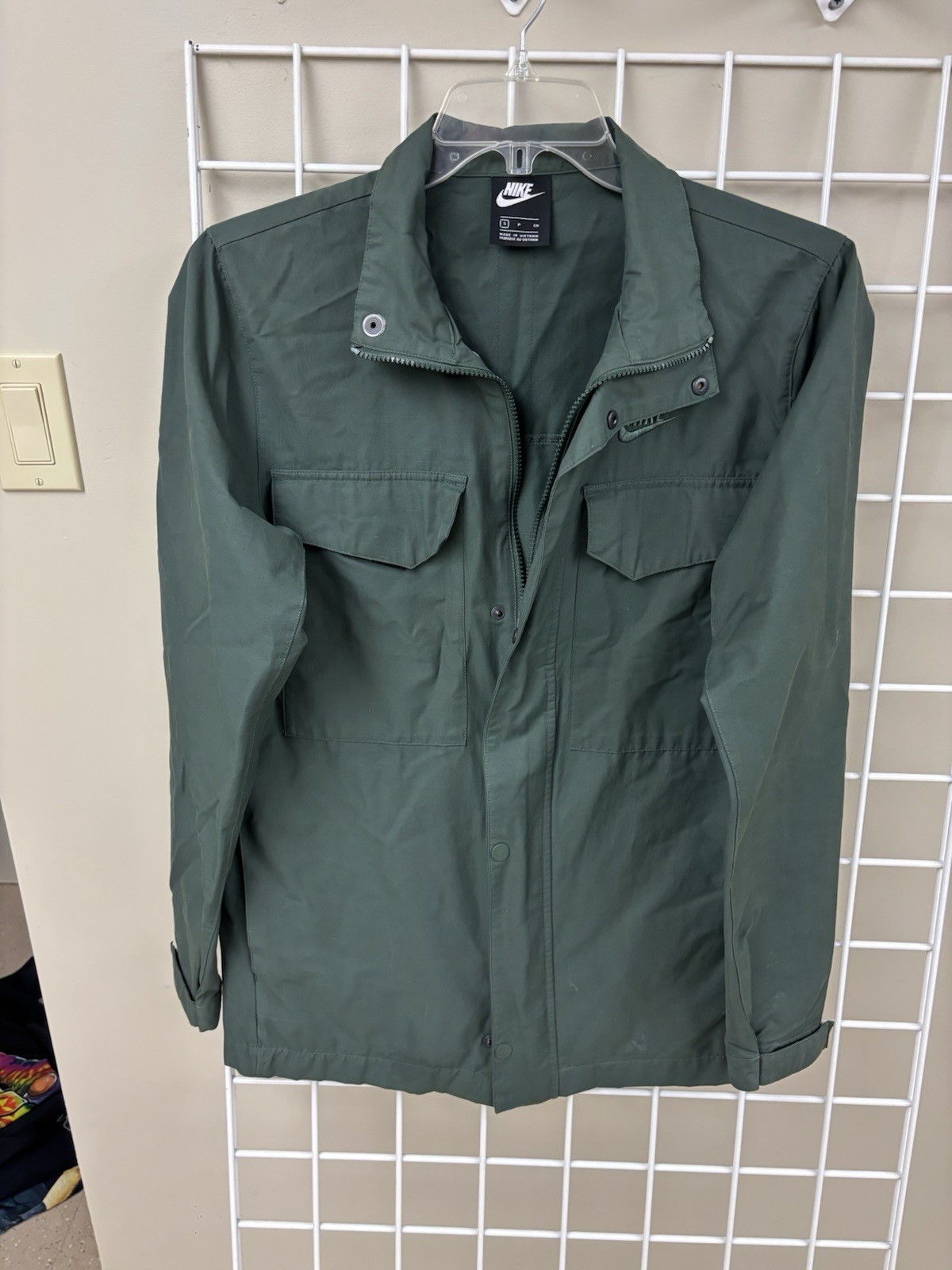 Nike green raincoat/jacket size small. Two chest vcro pocket