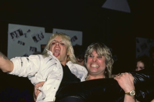 Ozzy Osbourne carries American singer musician Vince Neil at the a- Old Photo