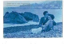 Old postcard 1920s lovers on the beach kiss lovers