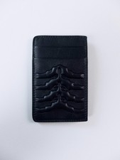  NO CUSTOMS TAX ALEXANDER MCQUEEN black rib cage embossed leather card holder