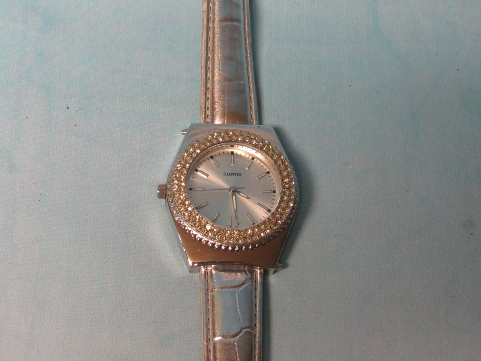 Ladies Watch With Spinning Rhinestones a Silver Leather Band