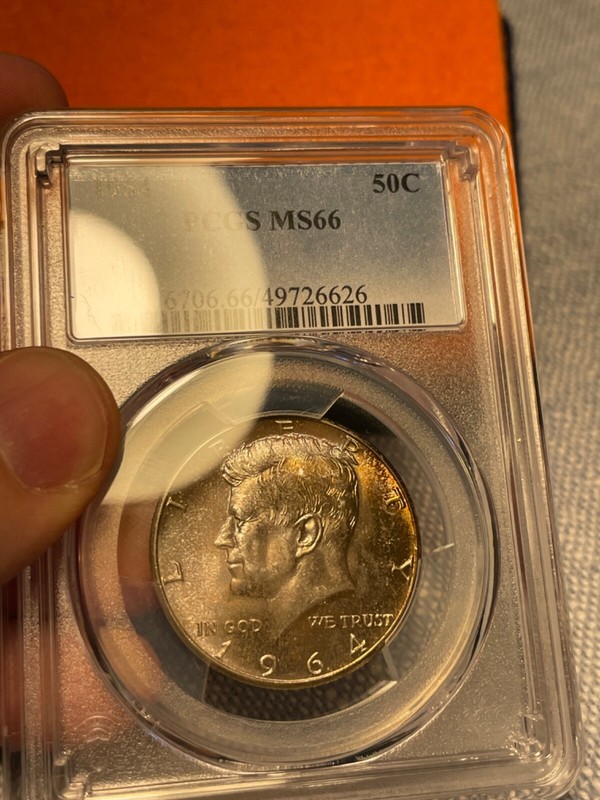 (#100375)   1964 Kennedy Half Dollar  Original roll rainbow toning! PCGS MS 66