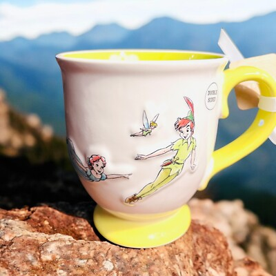 #ad Rae Dunn Disney Peter Pan Tinkerbell Wendy Flying quot;Never Grow Upquot; Mug White Cup $17.99