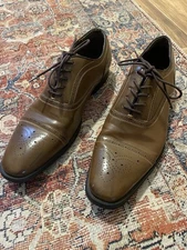Giorgio Brutini cap-toe oxford dress shoes with brogue detailing.