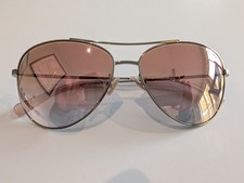 New COACH HC7079 90056F Sunglasses Light Gold Rose Gold Gradient lens and flash.