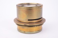 Vintage brass lens. Approximate focal length 220 mm.